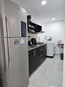 Kuchyň nebo kuchyňský kout v ubytování Apartamento en San Gil, moderno y excelente ubicación