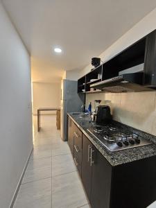 Kuchyň nebo kuchyňský kout v ubytování Apartamento en San Gil, moderno y excelente ubicación