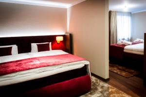 Hotel Jakobwirt Westendorf客房内的一张或多张床位