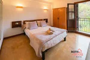 Posteľ alebo postele v izbe v ubytovaní Roth House