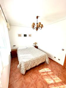 a bedroom with a bed in a room at Apartamento a pie de playa en El Portil in El Portil