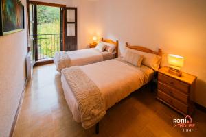 Posteľ alebo postele v izbe v ubytovaní Roth House