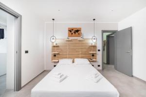 Postel nebo postele na pokoji v ubytování Sole Apartments