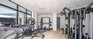a gym with treadmills and elliptical machines at Green Port ADMUS Apartments for Rent in Kołobrzeg