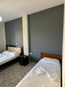 Postel nebo postele na pokoji v ubytování Privé City Hotel