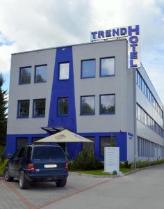 a van parked in front of a building at Trend Hotel in Námestovo