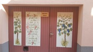 a red door with a bunch of writing on it at Apartment Schwär in Endingen