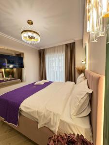 Ένα ή περισσότερα κρεβάτια σε δωμάτιο στο Green Tower Accommodation By GAP and Underground Parking