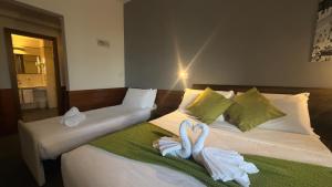Postel nebo postele na pokoji v ubytování Romalive Hotel + 35 fotografií