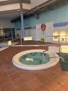 a room with a jacuzzi tub in the floor at Spectacular Flat Vera Playa in Playas de Vera