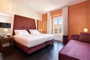Postel nebo postele na pokoji v ubytování Mascagni Luxury Rooms & Suites
