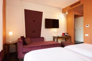 Postel nebo postele na pokoji v ubytování Mascagni Luxury Rooms & Suites