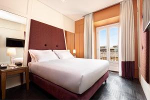 Postel nebo postele na pokoji v ubytování Mascagni Luxury Rooms & Suites