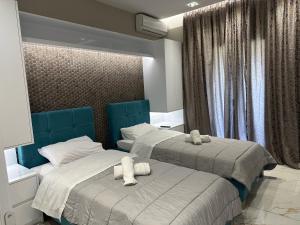 Postel nebo postele na pokoji v ubytování Evelina Luxury Suites in Corfu