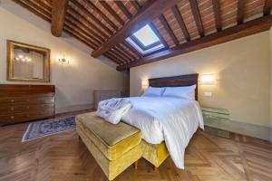 Postel nebo postele na pokoji v ubytování Residenza d'epoca Luca Pacioli