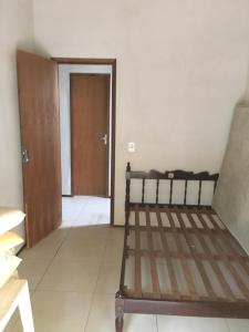 Giường trong phòng chung tại Casa com piscina Novo Iguape +6 ảnh