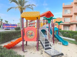 a playground in front of a building at Porto Matrouh Unique Chalet 73004 in Marsa Matruh