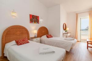 Ένα ή περισσότερα κρεβάτια σε δωμάτιο στο Beachline Apartment in Praia da Luz