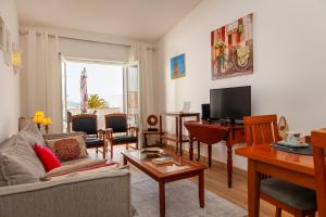 Μια τηλεόραση ή/και κέντρο ψυχαγωγίας στο Beachline Apartment in Praia da Luz