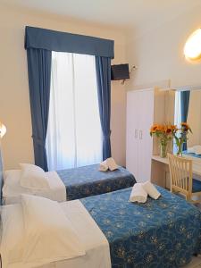 Katil atau katil-katil dalam bilik di Albergo Marechiaro