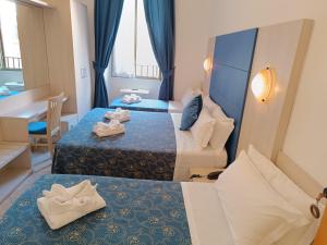 Katil atau katil-katil dalam bilik di Albergo Marechiaro