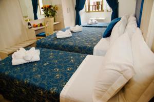 Katil atau katil-katil dalam bilik di Albergo Marechiaro