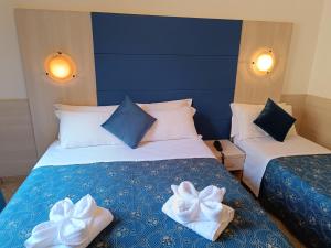 Katil atau katil-katil dalam bilik di Albergo Marechiaro