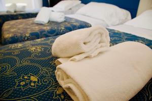Katil atau katil-katil dalam bilik di Albergo Marechiaro