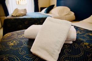 Katil atau katil-katil dalam bilik di Albergo Marechiaro