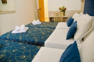 Katil atau katil-katil dalam bilik di Albergo Marechiaro