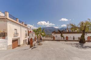 an empty street in the middle of a building at RentitSpain Casa Lavadero Historia y confort in Laujar de Andarax