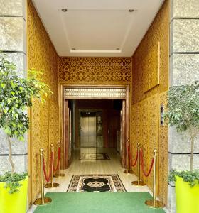 a hallway of a building with a green carpet at Maarif elite suites in Casablanca