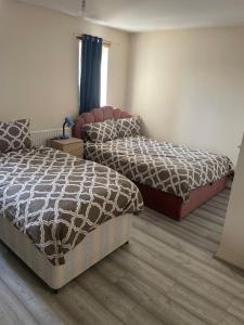 Postel nebo postele na pokoji v ubytování 8 braybrook crescent