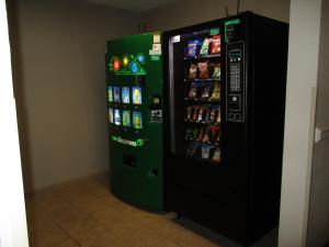 a soda vending machine in a room at Studio 6 Extended Stay - Richmond, VA - I-64 West in Sweet Briar Park