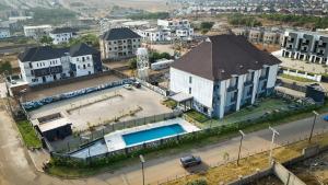 an aerial view of a large house with a swimming pool at Noble Nook Boutique Hotel Abuja in Abuja
