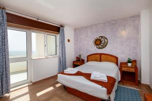 Postel nebo postele na pokoji v ubytování Casas da Calheta in Praia da Luz + 14 fotografií