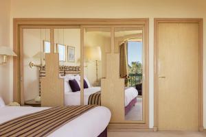 Postel nebo postele na pokoji v ubytování Es Saadi Marrakech Resort - Hotel