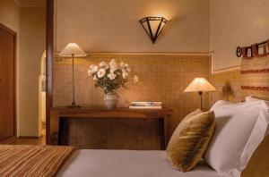 Postel nebo postele na pokoji v ubytování Es Saadi Marrakech Resort - Hotel