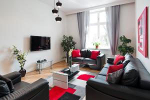 Televízia a/alebo spoločenská miestnosť v ubytovaní Neo Apartments