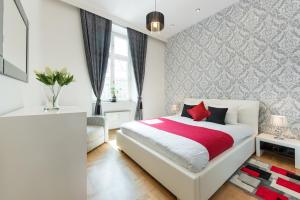 Posteľ alebo postele v izbe v ubytovaní Neo Apartments