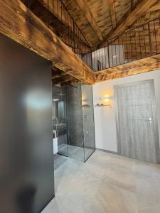 a bathroom with a shower and a glass door at Dimora Rosaspina in Adro +41 photos