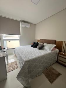 Ένα ή περισσότερα κρεβάτια σε δωμάτιο στο Casa para Rondônia Rural Show