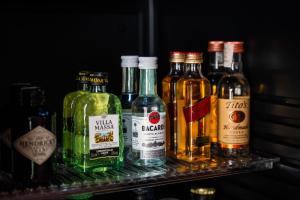 a group of bottles of alcohol sitting on a shelf at Antalia Boutique Hotel in Positano