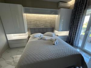 Postel nebo postele na pokoji v ubytování Evelina Luxury Suites in Corfu