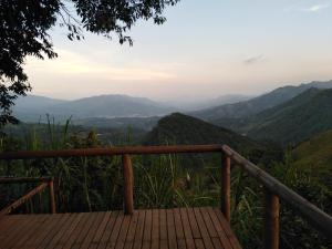 a view of the mountains from a wooden deck at Ecobindu-Domo in Albán