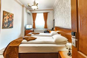 Postel nebo postele na pokoji v ubytování Hotel Boutique Bulevard