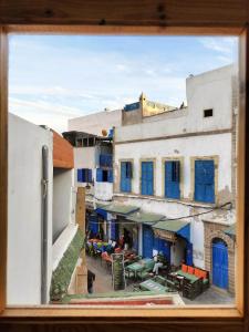 a view of a city from a window at Appartement avec terrasse privé in Essaouira