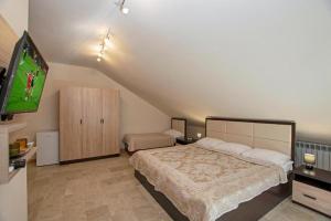 Postel nebo postele na pokoji v ubytování Seasons Boutique Hotel