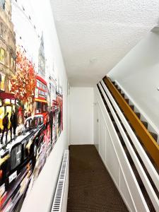 a hallway with a mural of a bus on the wall at 3 Bedroom House, WiFi & Free Parking in Chatham
