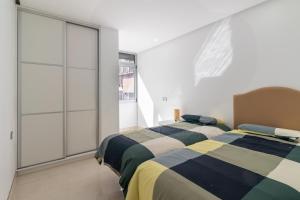 Postel nebo postele na pokoji v ubytování Dar Alisios 3